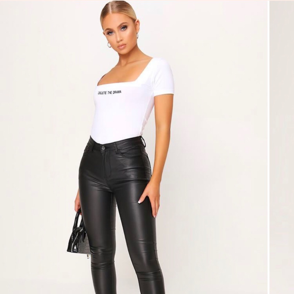 Black Coated button front skinny jeans with zip